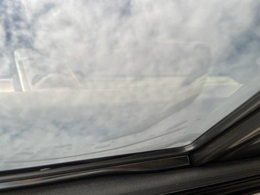 Vizion AutoSports - Bubbles in the roof tint, gaps in the edges, and loose tint hanging down.