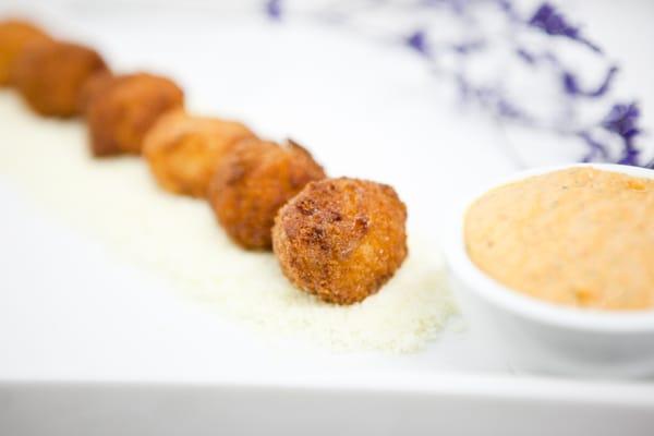 Mac and Cheese Fritters served with a roasted red pepper dip