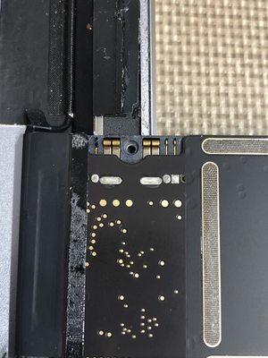 Prior repair by another shop. That broken pin on the battery connector cause the device to boot-loop.