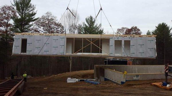 Delivery of prefab home onto the foundation we poured earlier in the month.