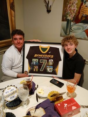 Lacrosse jersey in a shadow box.