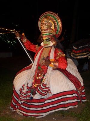 A traditional dancer in full costume in Kerala, India.