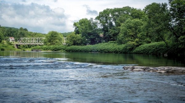 Rocky beach is 7-minute walk downstream from bridge