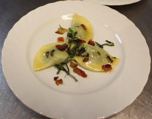 Homemade mushroom ravioli with a bacon and sage butter sauce