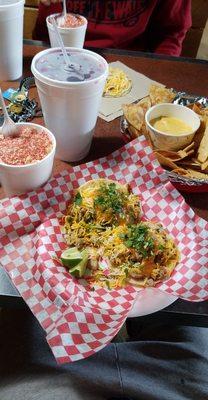 Pollo tacos, Takis Fuego elote cup, queso dip, & Jamaica flavored water