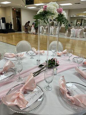 I provided the chiffon runner, charger plates, napkins, glasses, custom menu, acrylic stand with fresh florals. DecorbyDuBois