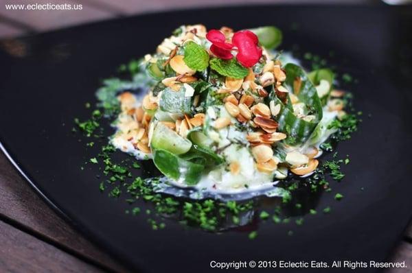 Yogurt Cucumber Salad topped with Fresh Mint & Toasted Almonds & Pine Nuts