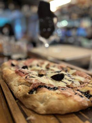 Prosciutto, Swiss, balsamic and fig pizza at the bar