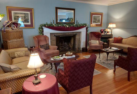 The parlour end of the Great Room is set for visiting, teatime, and more. The other end of the room (not pictured) is used for event space.