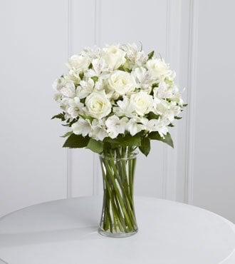 This is what we were supposed to get. Notice all the beautiful white roses in the arrangement.