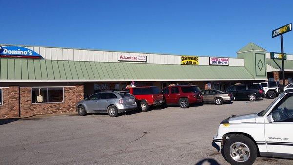 Busy loan office in DeSoto by Subway and Domino's