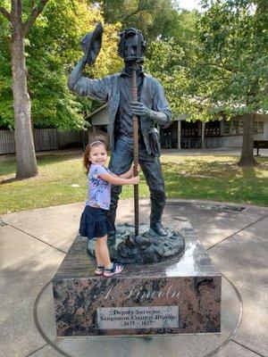 Lincoln as a surveyor and cute grandchild.