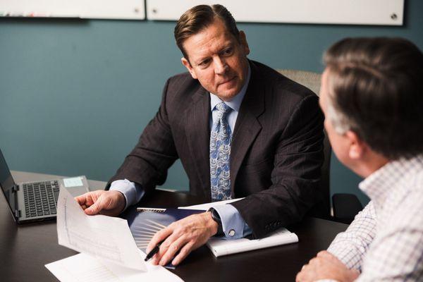 Bill Graves, Financial Advisor at Outlook Wealth Advisors, consulting with a client.