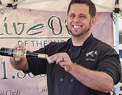 the chef pours Fresh From Florida EVOO