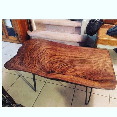 A live edge coffee table made from a slab of elm bought at Willard.