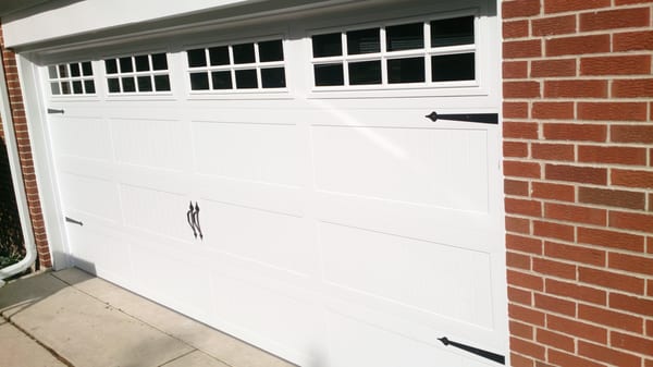 AFTER: This Carriage House garage door with stockton windows was the "face lift" our customer's home needed.