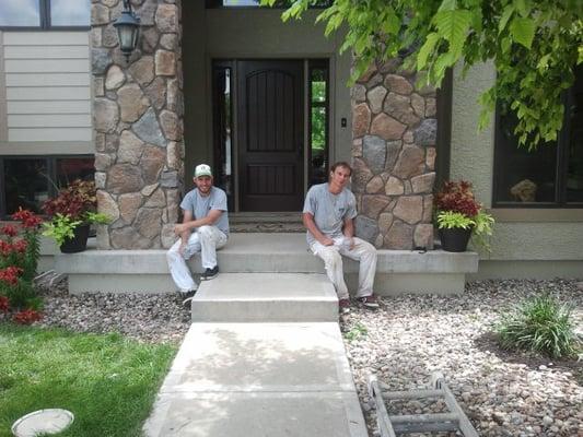 Nathan and Jo enjoying the finish of a large exterior paint job in Spring Hill, KS