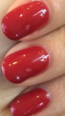 Nails look like they dripped product to the side and are forming bubbles.