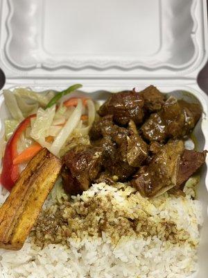 Blue mountain curry goat , white rice , sides : steam veg an sweet plantain