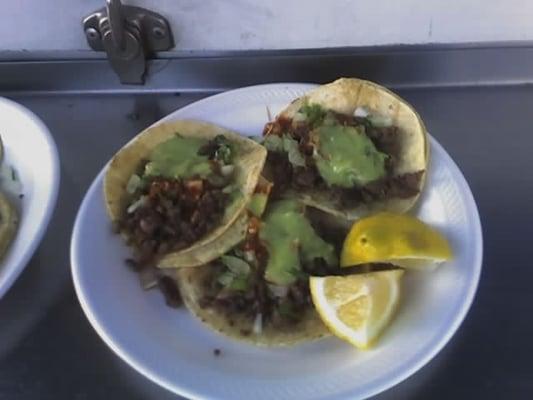 Yummy carne asada tacos w/ the works $1