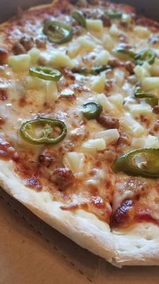 Closer view of the sausage, pineapple and jalapeno pizza