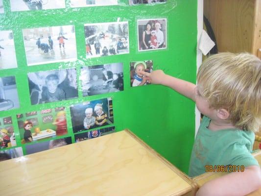 One of our toddlers looking at our picture wall.