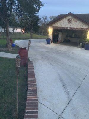 Concrete patio with drive way for residential home.