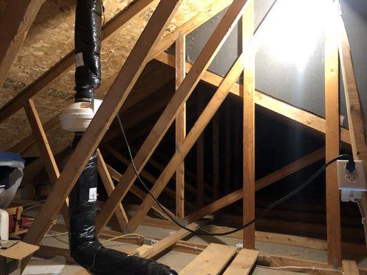 radon fan in garage attic. Insulated pipe to prevent freeze up and condensation.