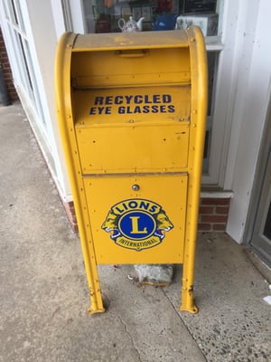 The Lions' eyeglasses collection box in front of Woodbury Drug Co.