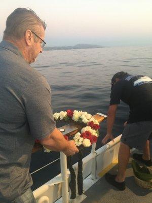 Getting ready to drop the burial wreath at sea