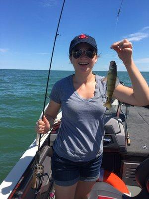 Happy girl with first perch of the day.