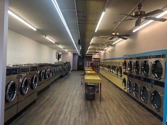 Picture of laundromat from front to back.