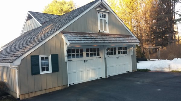 Garage door overhang with custom timber brackets