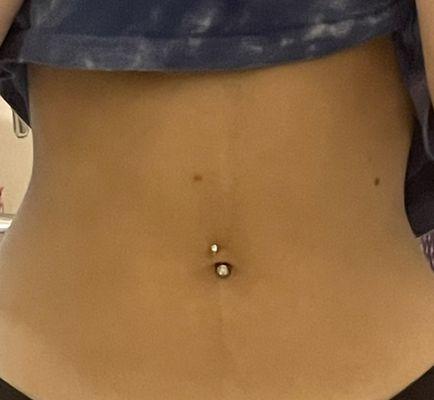 crooked belly piercing