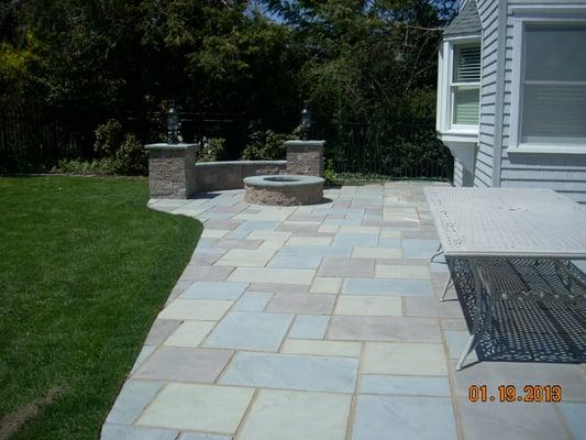 Patio with fire pit and seat wall