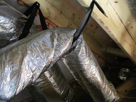 There were multiple air ducts in the attic of this new home that will severely restrict airflow due to poor workmanship.