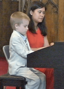 Young student Ian W. plays a duet with teacher Erika Stalcup.