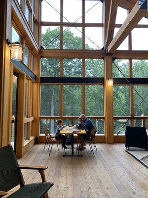 Amazing screened in porch with board games