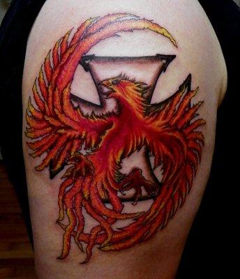 Maltese cross and Phoenix on upper arm, art by Libby.