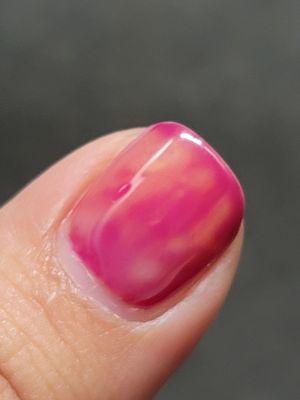 Nail polish should be the red color instead it looks like puke.