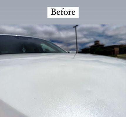 Hail damaged hood of car - before picture