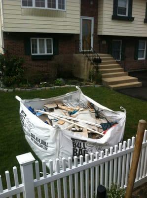 We can pickup behind fences.  Try doing that with a metal dumpster