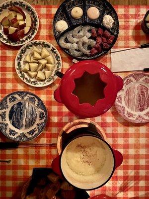 Beef & Shrimp Hot Pot, cheese fondue with a side of bread, potatoes, & apples.