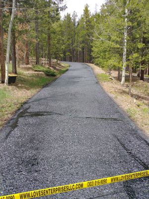 Driveway sealcoating and crack repair in Conifer Colorado.