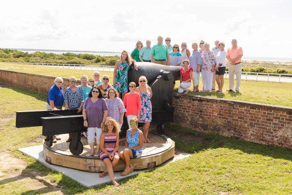 The Realty World - First Coast team next to one of the many cannons at Fort Macon State Park.