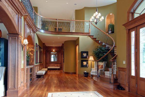 Luxurious foyer/entry way with grand staircase