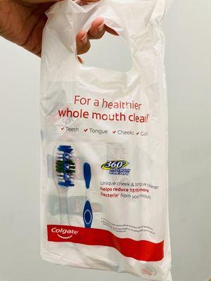 Goody bag with toothbrush, floss and coupons!