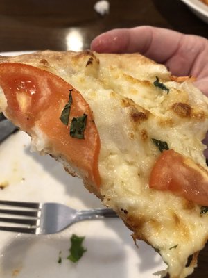 Margherita pizza with crunchy outside and soft inside crust