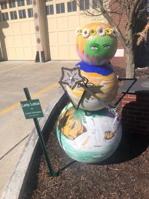 Snowman  made by an artist during the winter in front of firehouse.