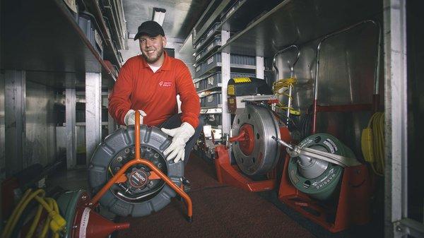 Technician preparing to do a video inspection by gathering equipment from our fully equipped service truck. Inspection, Video, Drains, Sewer